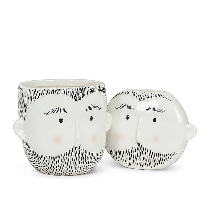 White ceramic planter with a minimalist bearded face design and soft blush cheeks, modern home decor accessory.