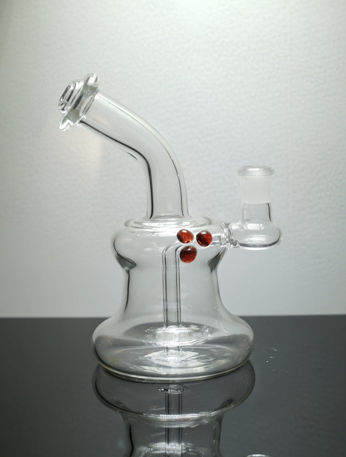 Brickyard Glass Bubble Banger Hanger, a stylish and functional compact dab rig with enhanced airflow for clean hits, available in Teal, Red, and Purple.