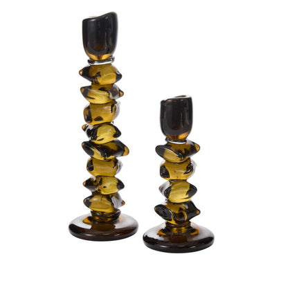Set of two amber glass candleholders with an artistic, stacked organic design for home decor accents.