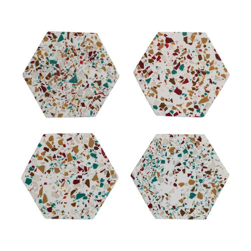 Set of four hexagon resin coasters with multicolored terrazzo pattern for stylish home decor.