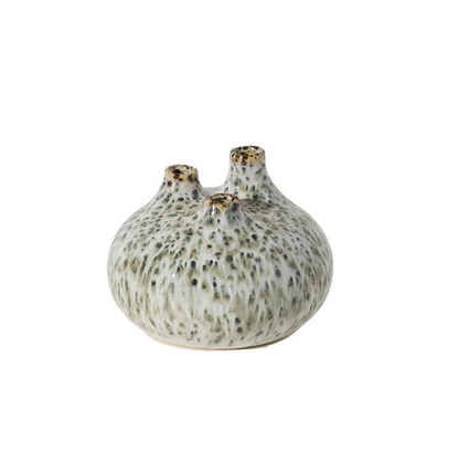A small ceramic bud vase with three protruding necks, covered in a speckled cream and olive-green glaze with subtle gold accents on the rims, set against a plain white background.