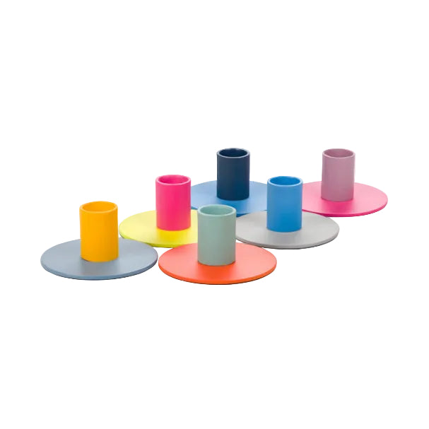 Set of colorful metal candle holders with two-tone design for modern home decor and candles display.