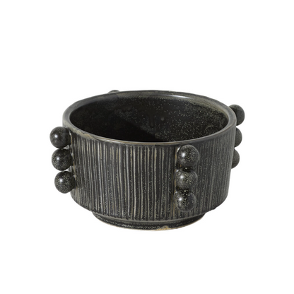 A dark gray ceramic planter pot with a ribbed exterior and decorative spherical bead accents on the sides, shown against a plain white background.