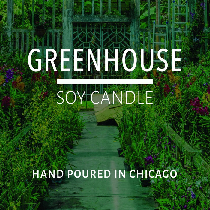Lush greenhouse pathway filled with vibrant plants and flowers representing natural home decor inspiration.