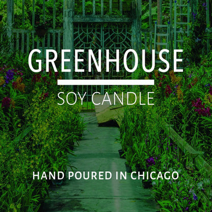 Lush greenhouse pathway filled with vibrant plants and flowers representing natural home decor inspiration.