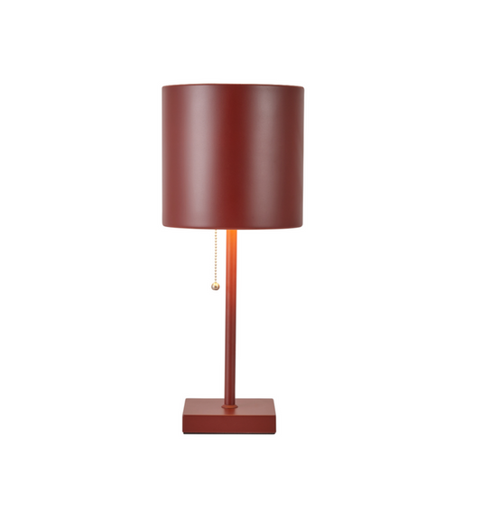 Minimalist red metal table lamp with cylindrical shade and pull chain switch, ideal for modern home decor lighting