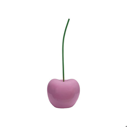 Glossy pink decorative cherry sculpture with a slender green stem, modern home decor accent piece.