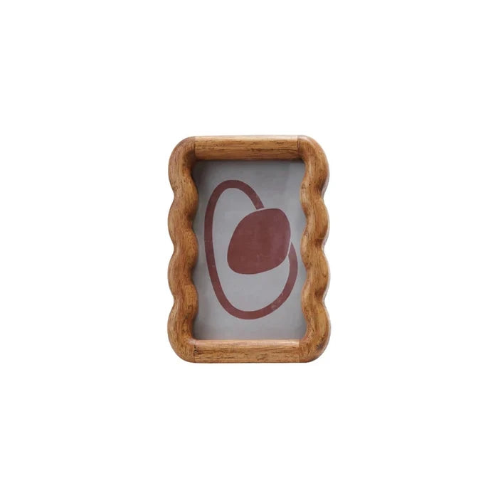 Wooden photo frame with scalloped edges displaying abstract art in muted tones