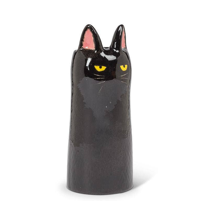 Glossy black ceramic cat-shaped vase with yellow eyes and pink inner ears, minimalist modern home decor piece.