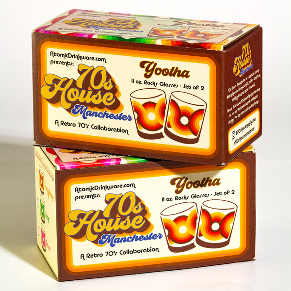Stacked retro-style packaging boxes featuring colorful 70s inspired artwork for a set of two rocks glasses.
